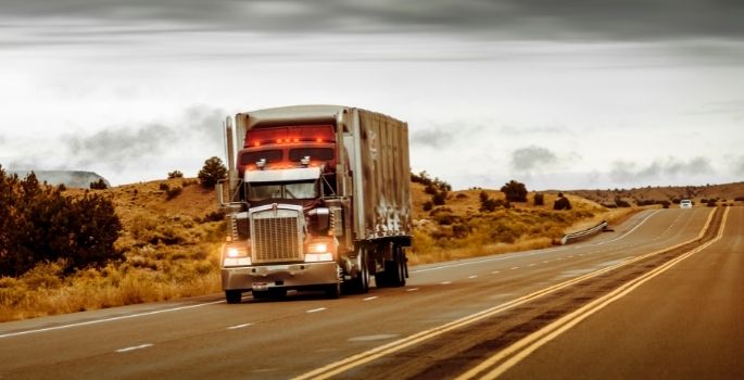 truck driving down highway