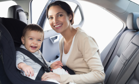 child in car seat with mom