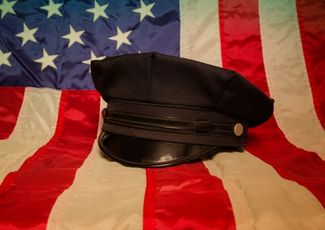 police hat on flag