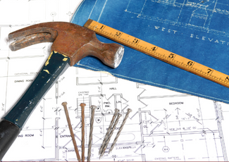 Ruler, hammer, nails and plans