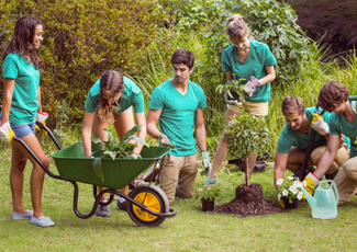 Volunteers doing yardwork.