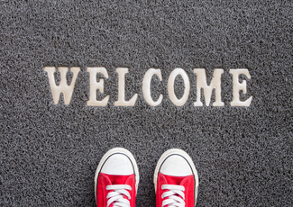 Welcome mat with shoes.