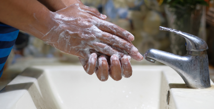 Hand washing with water off.