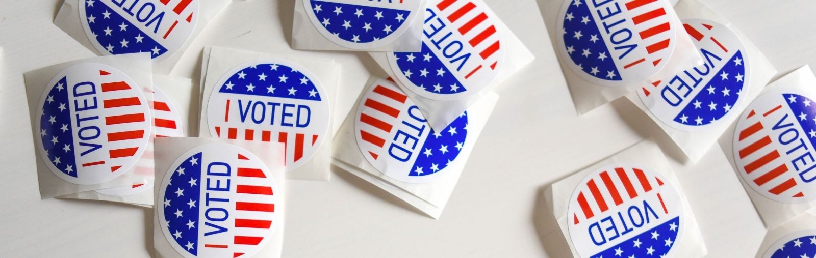 I Voted stickers scattered on a table