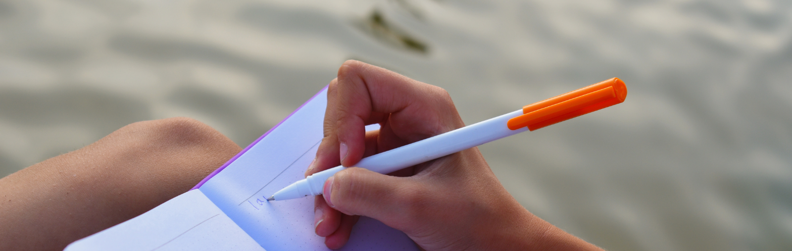 A young writer begins writing their next great short story or poem by the water this summer