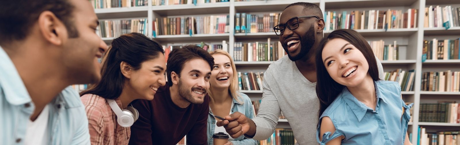 A group of people talking and laughing around a table