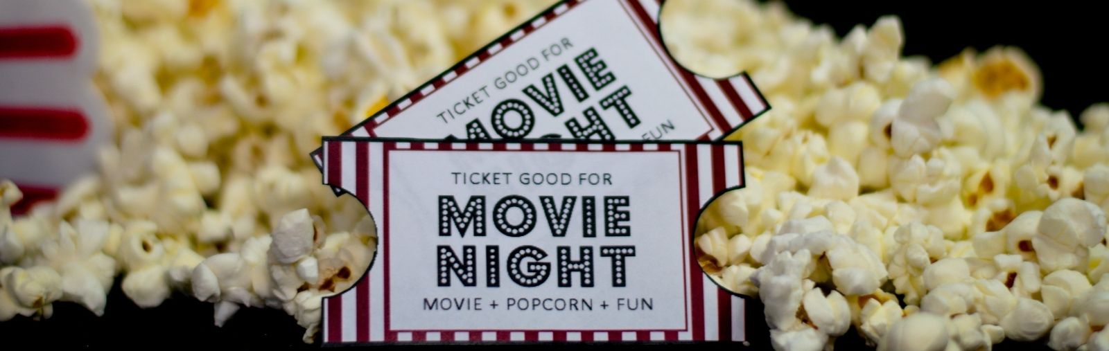 Movie tickets in front of popcorn