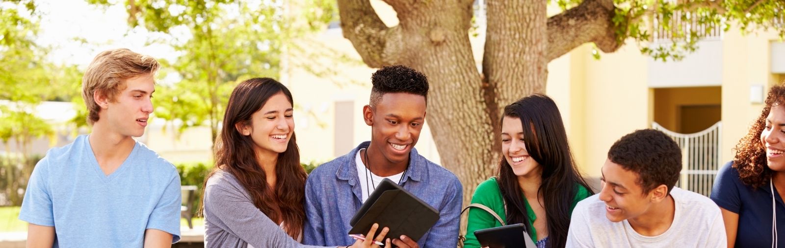 Teens talking and sharing phones