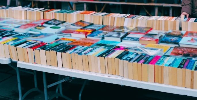 A table covered in used books