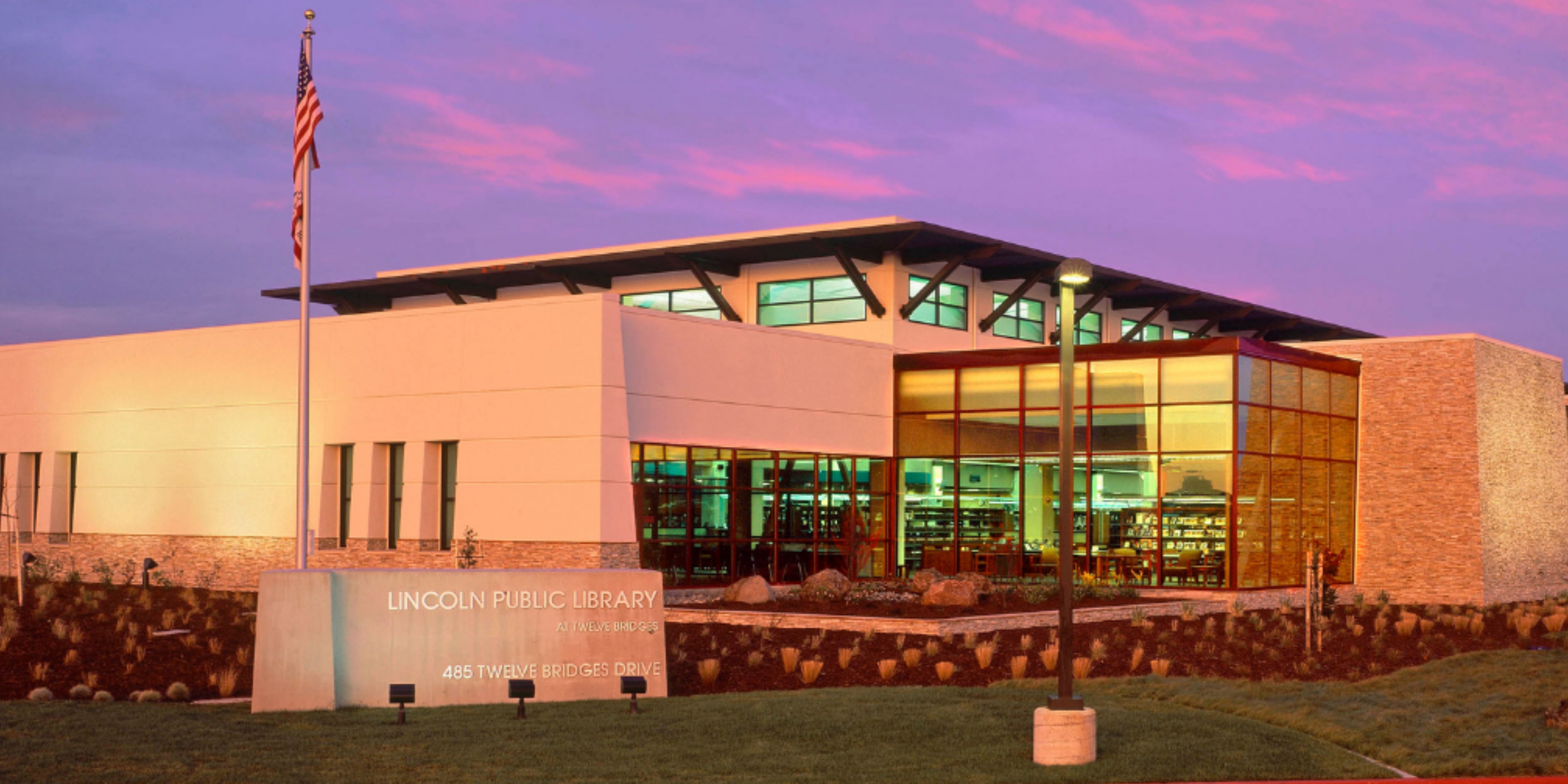 White building with sunset behind