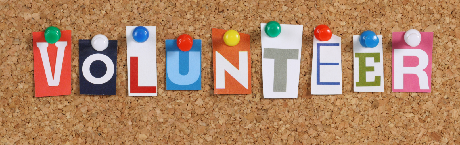 Volunteer spelled out on bulletin board