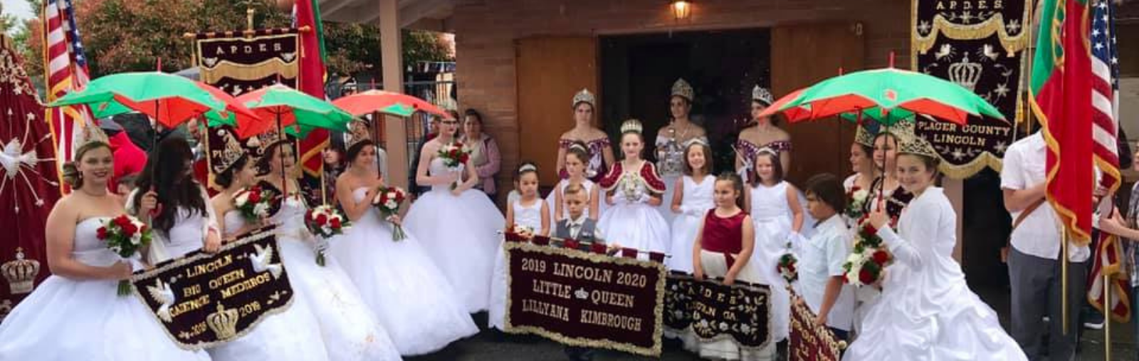 parade princesses standing in front of building