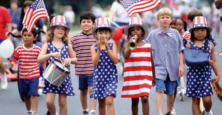 children walking in 4th of July parade