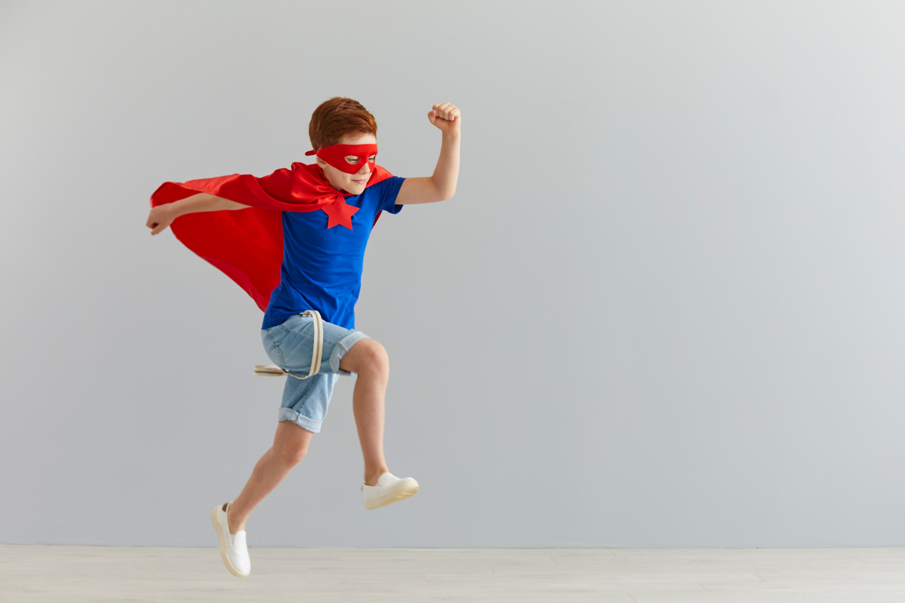 Young boy dressed up as superman