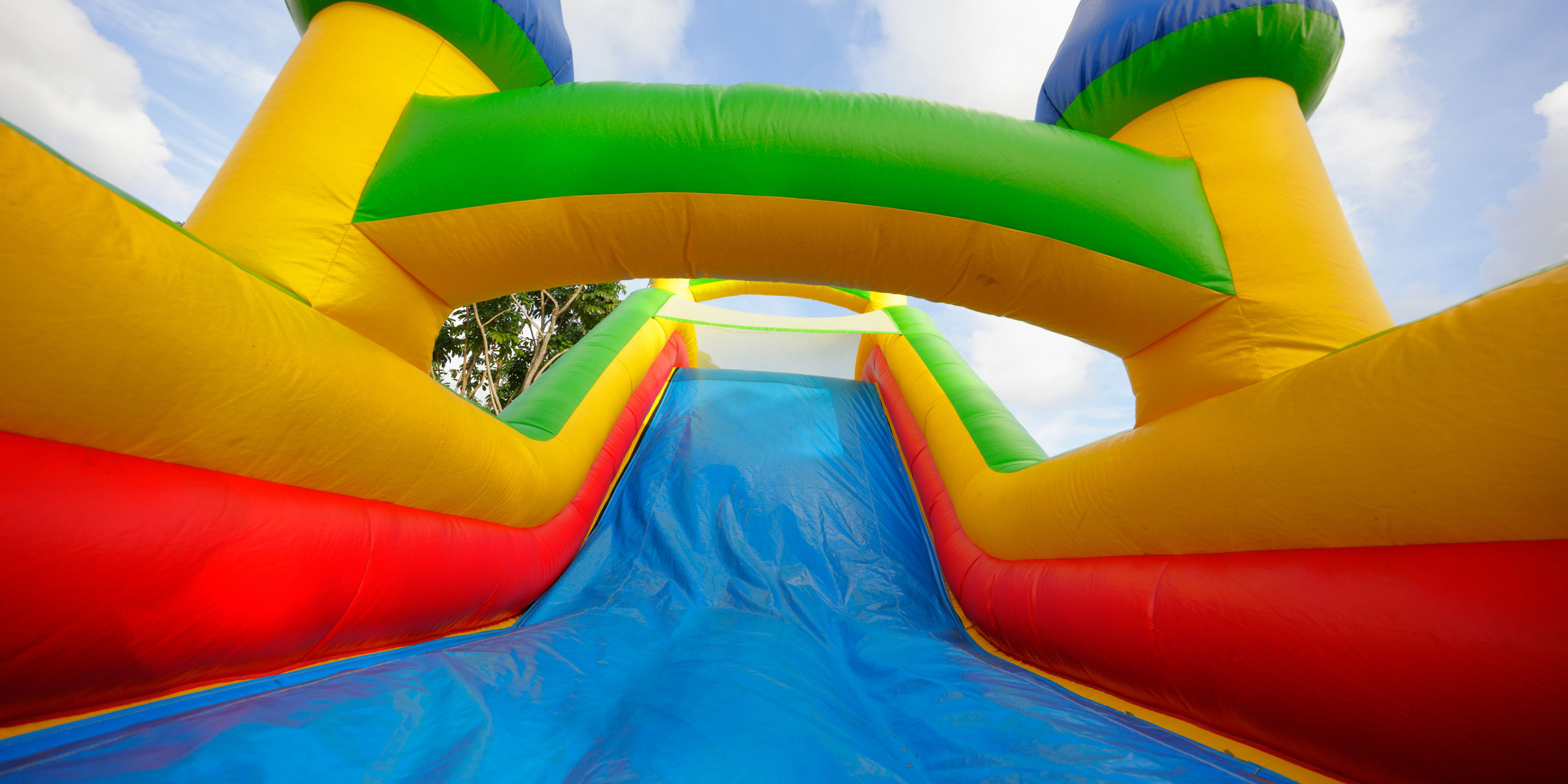 Blue, green, yellow and red bounce house castle