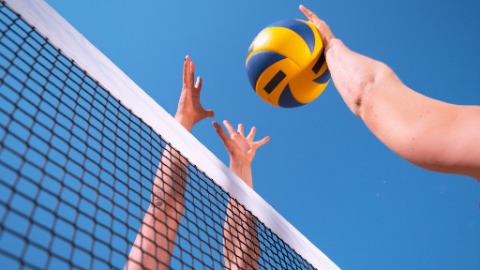 volleyball over net with hands