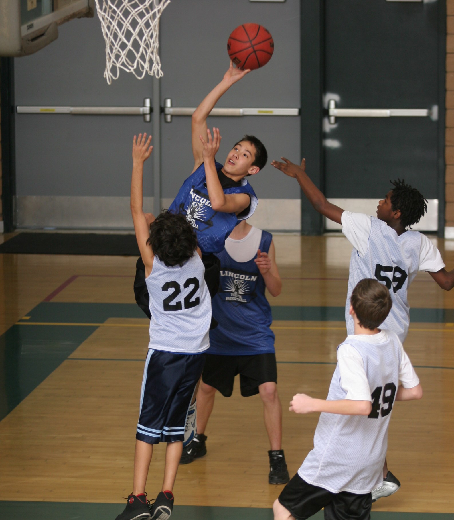 Youth Basketball Player Shooting a Layup
