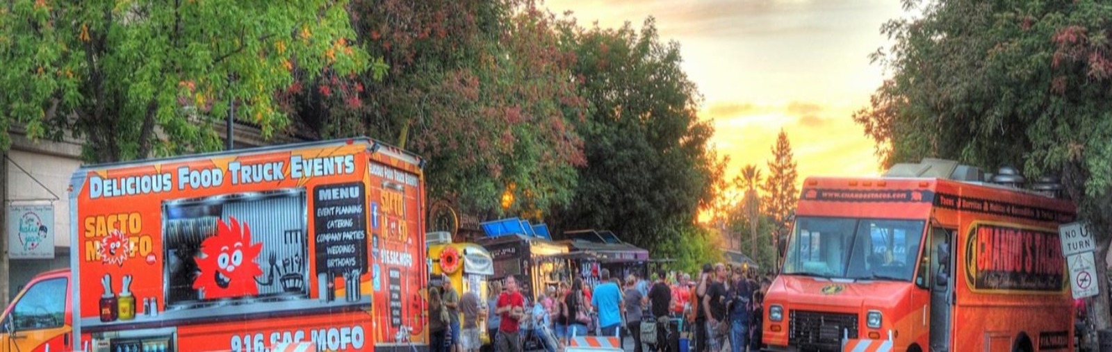 Street of people at food truck event 