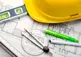alt="Plans, construction hat, level"