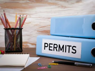 alt="Binder with permit label"