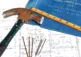alt="Ruler, hammer, nails and plans"