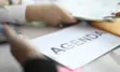 alt="Agenda typed on paper."